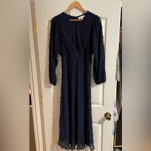 Navy, long sleeved, mid length, excellent condition.